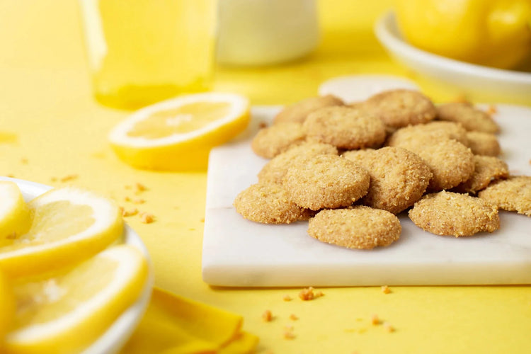 highkey low sugar glutenfree lemon cookies with slices of lemon 
