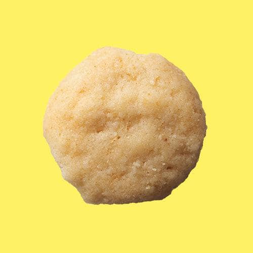 Highkey gluten free low sugar lemon mini cookie on a yellow background