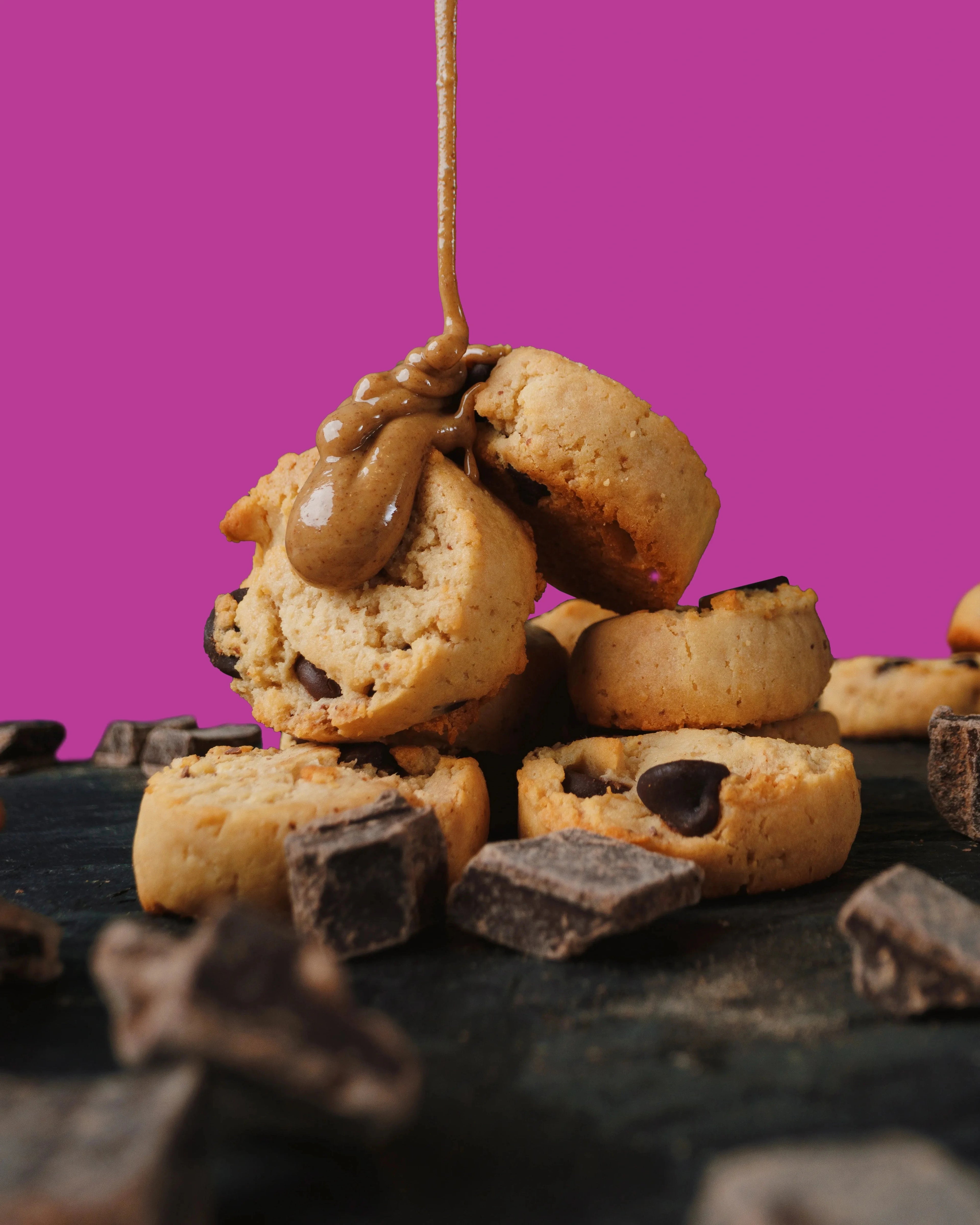 highkey gluten free low sugar high protein mini almond butter cookies with chocolate chips are drizzled with  almond butter and chocolate chips